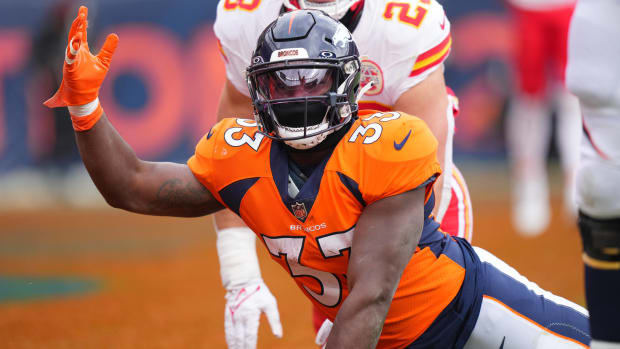 Oct 29, 2023; Denver, Colorado, USA; Denver Broncos running back Javonte Williams (33) reacts following his touchdown in the first quarter against the Kansas City Chiefs at Empower Field at Mile High. Mandatory Credit: Ron Chenoy-USA TODAY Sports